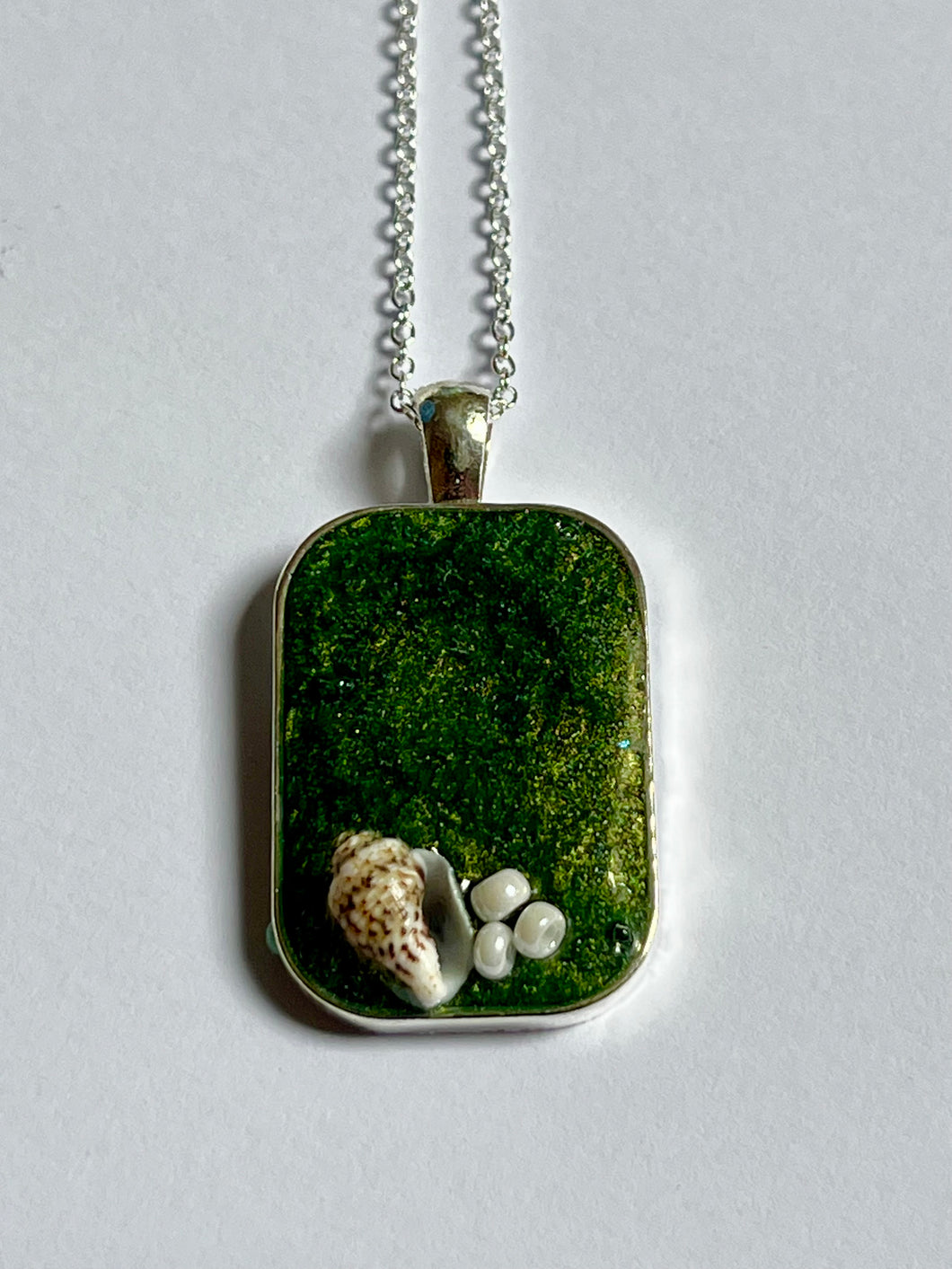 Sea green rectangular pendant with shell and white beads