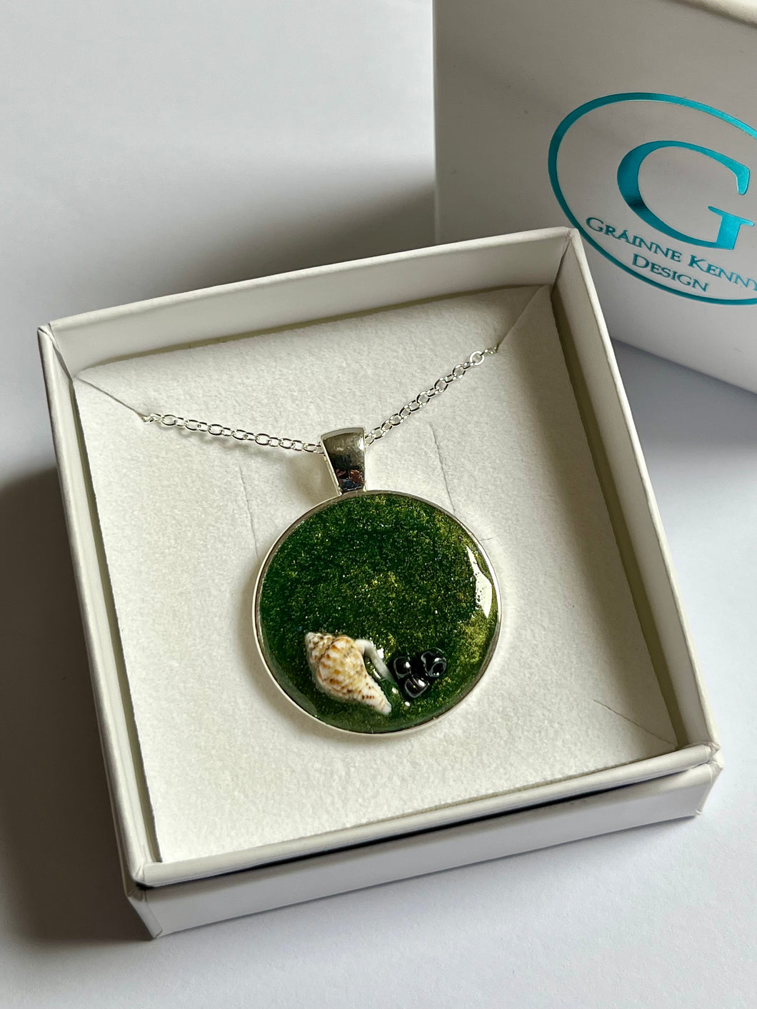 Small round sea green pendant with seashell and grey glass beads