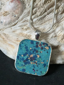 Square Resin Pendant with crystal flakes.
